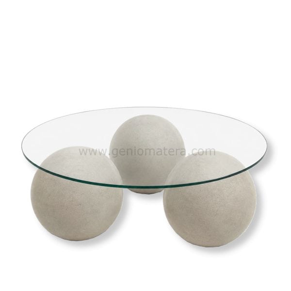 Mesa de centro con base de bolas de concreto y tapa de vidrio.